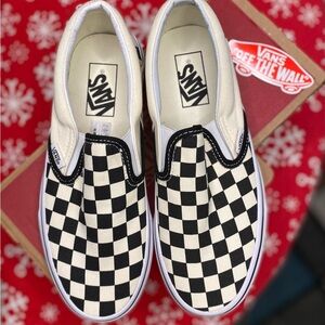 Vans Women’s Black and White Checkerboard Slip-Ons